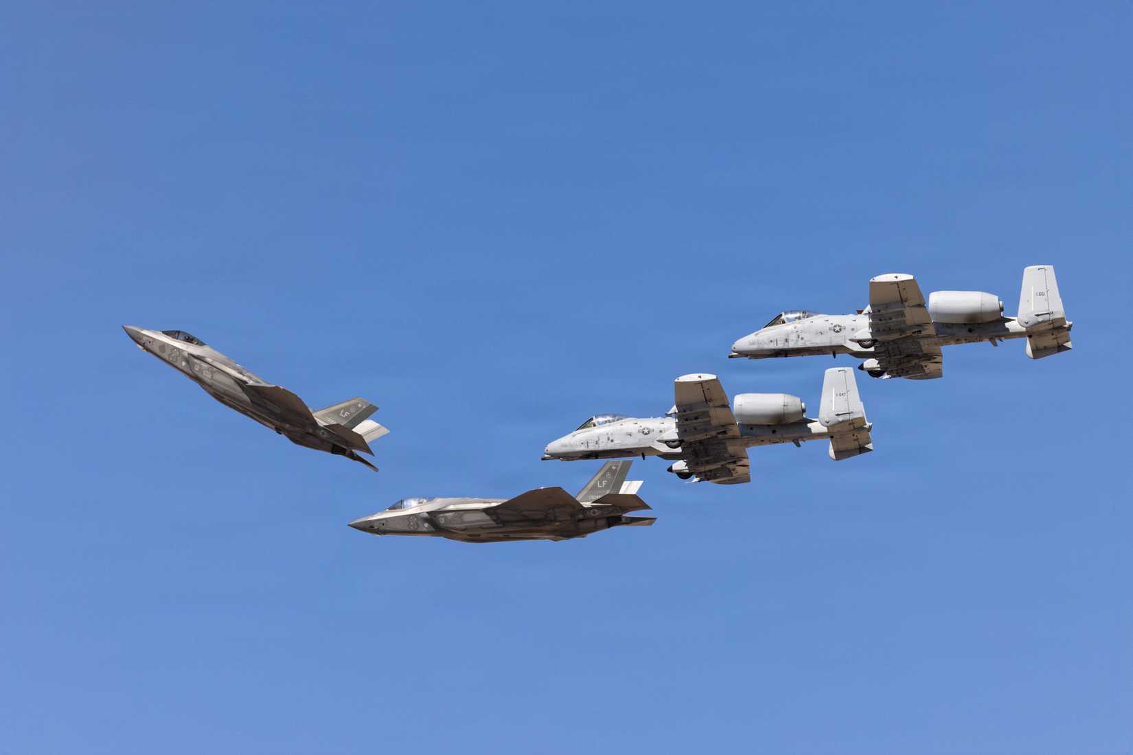 An F-35A Lightning II pitches and breaks formation to land during the Luke Days 2026 airshow.