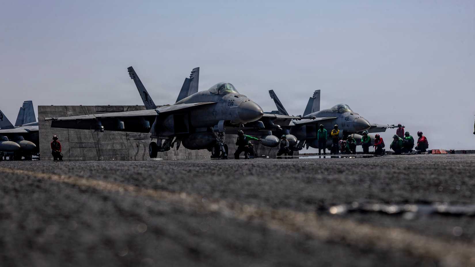 An FA-18E Super Hornet, attached to Strike Fighter Squadron (VFA) 14, left, and an FA-18E Super Hornet, attached to Strike Fighter Squadron (VFA) 151.