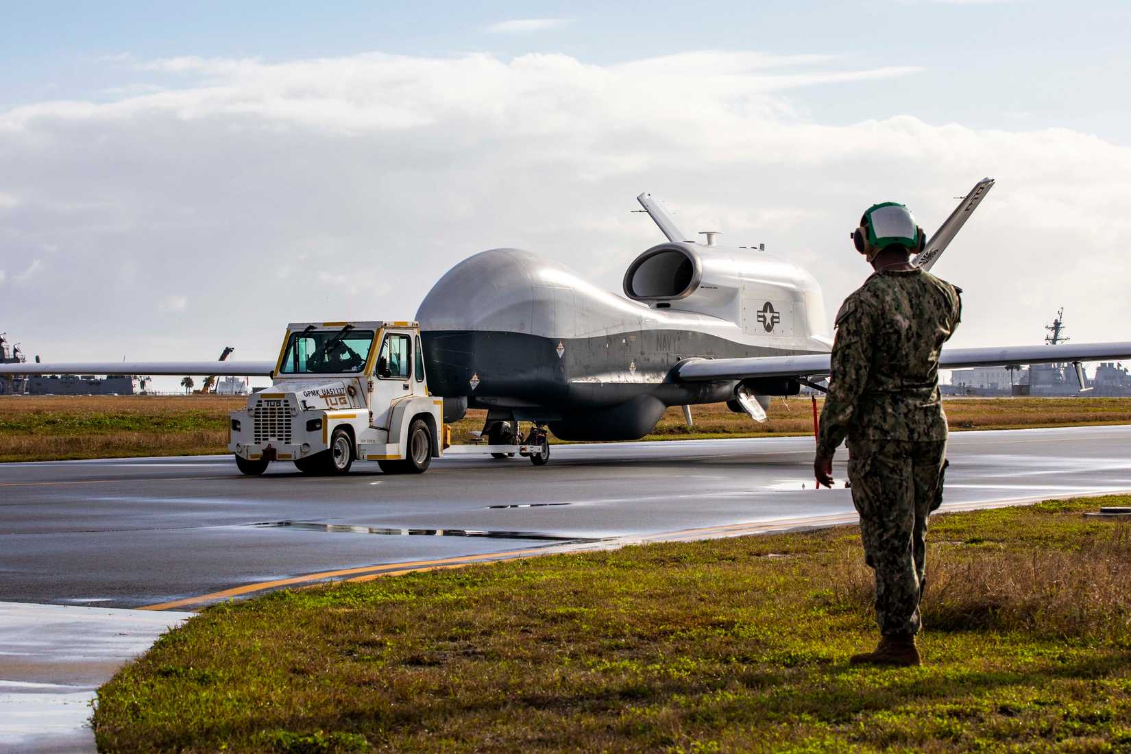 An MQ-4C Triton Unmanned Aircraft System (UAS), assigned to Unmanned Patrol Squadron 19 (VUP-19), taxis across the flight line at Naval Station Mayport, Florida, Dec.