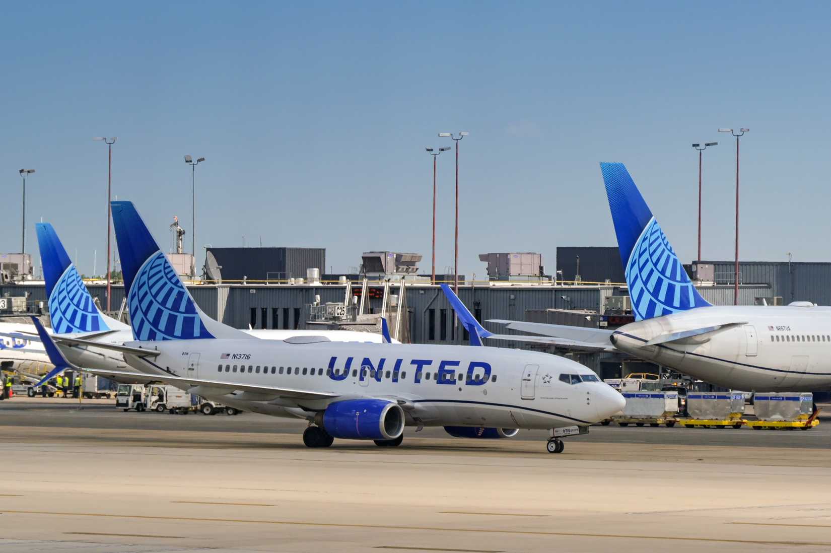 Boeing 737 (registration N13716) operated by United Airlines taxiing for take off at Dulles International airport