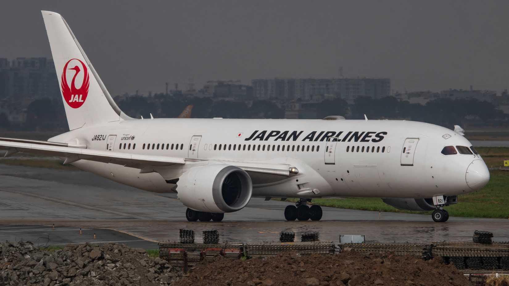 Boeing 787-8 Dreamliner reg JA821J of Japan Airlines departure after the rain at Ho Chi Minh City International Airport.