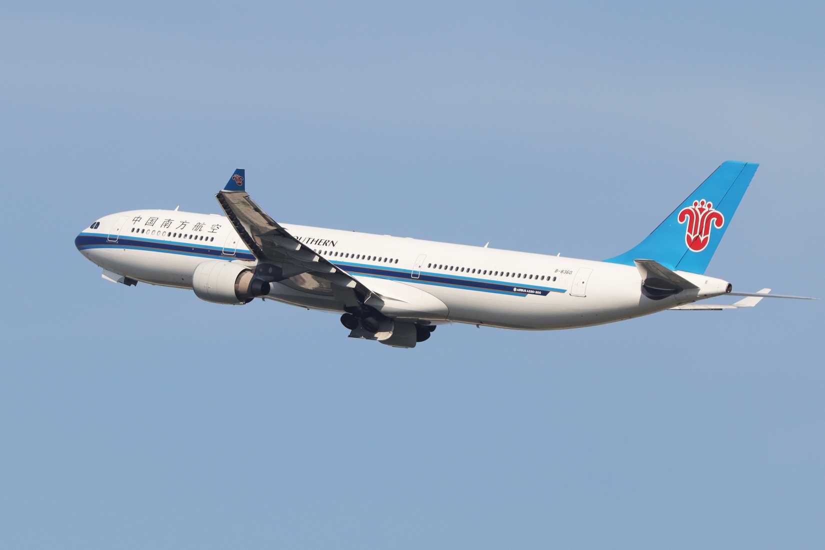 China Southern A330-300 climbing across clear skies