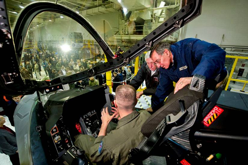 Defense Secretary and U.S. Rep. of Maryland look at the cockpit of the F-35 Joint Strike Fighter with Navy Capt. Etz, 2012.