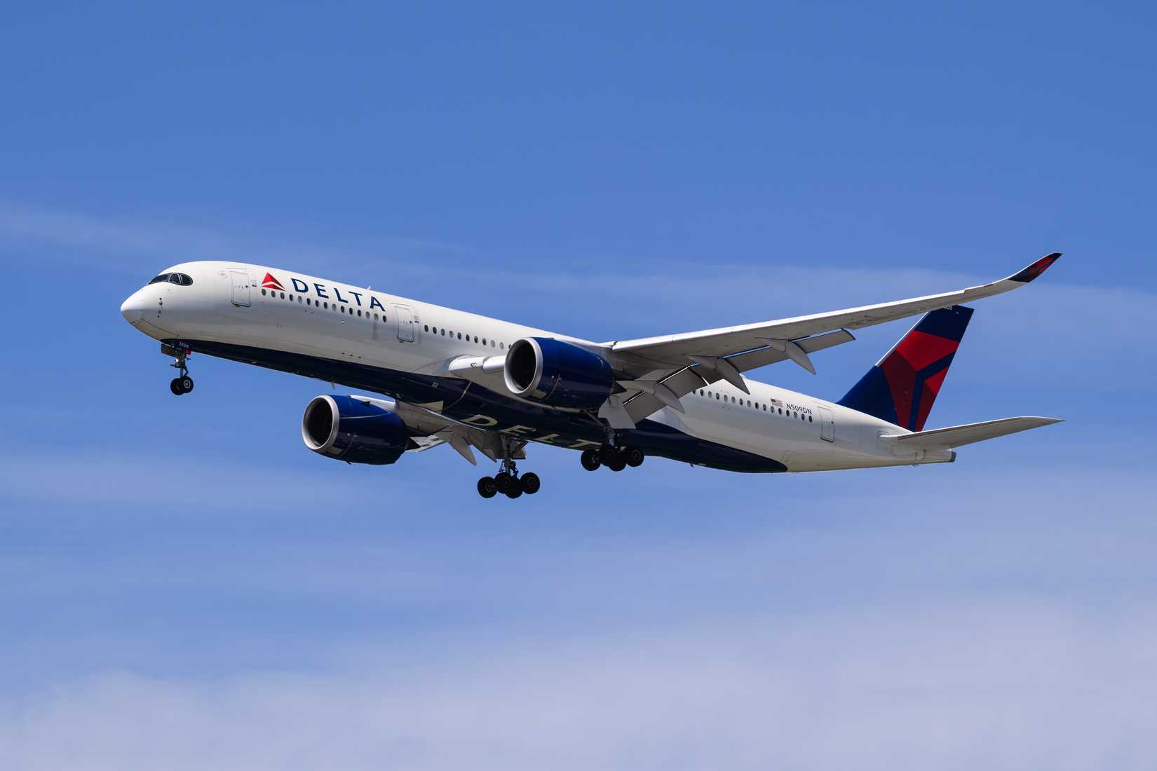 Delta A350-900 flying across clear skies