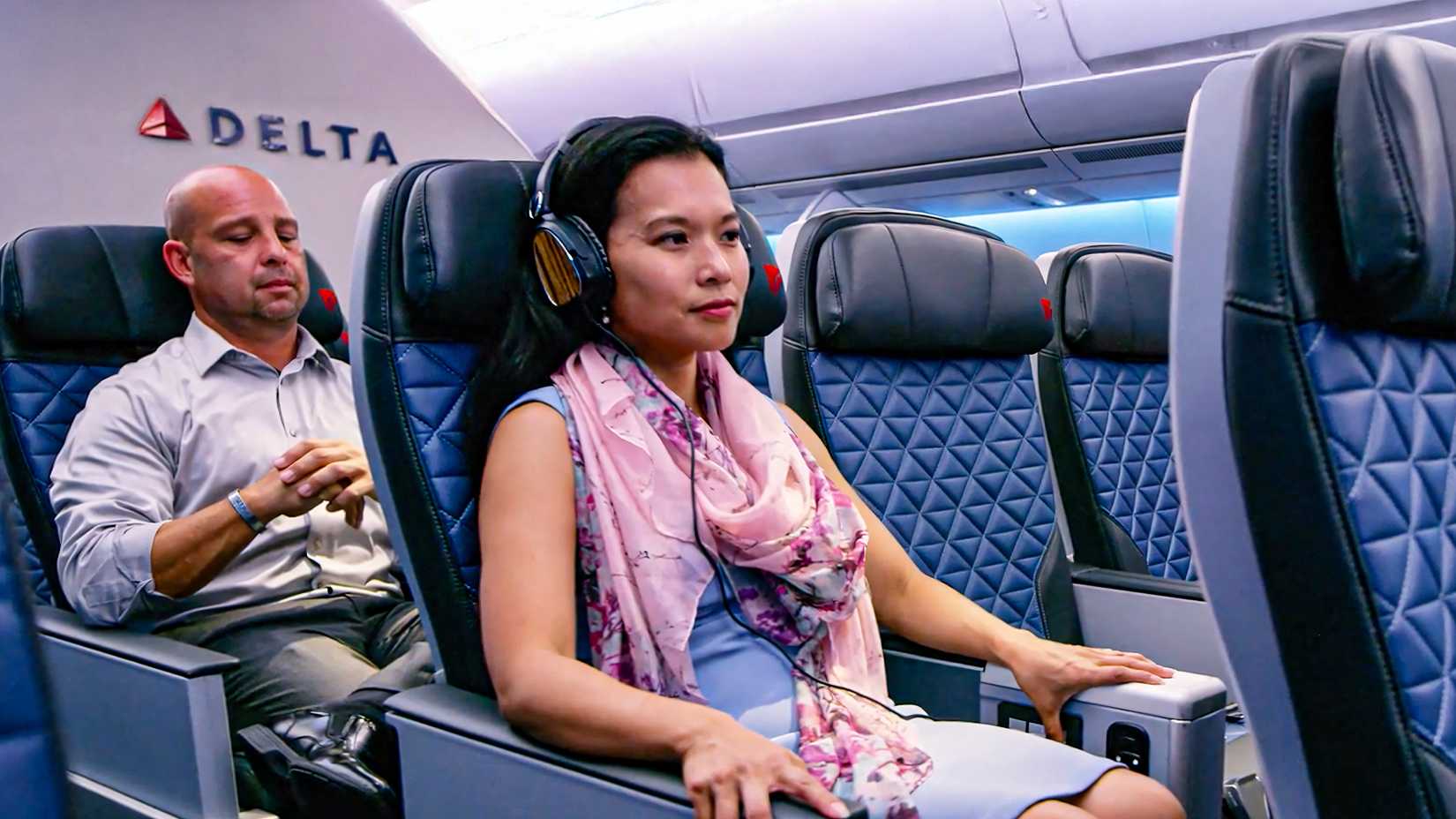 A Woman In A Premium Economy Seat