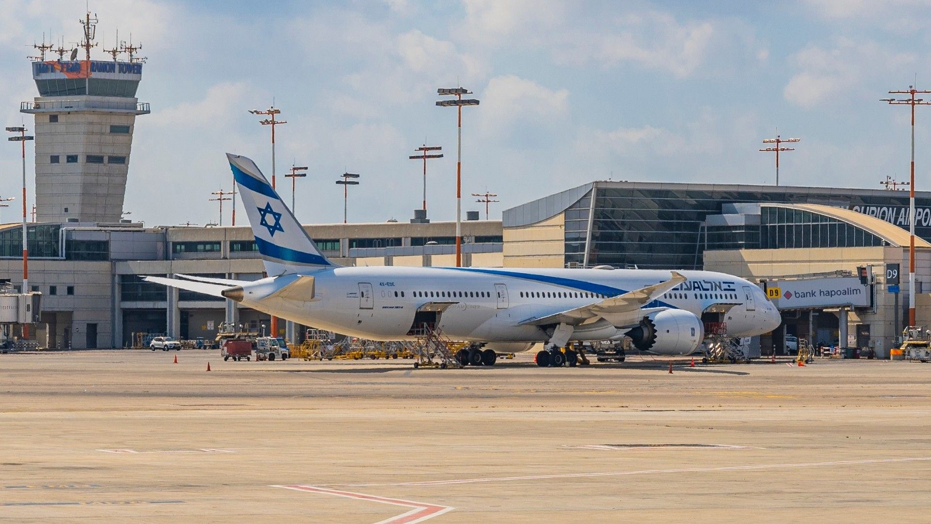 El Al 787 parked at an airport terminal