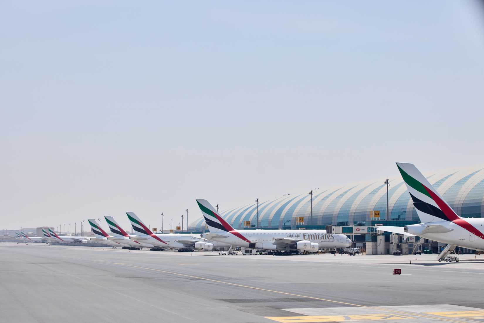 Multiple Emirates Aircraft parket at DXB Terminal 3