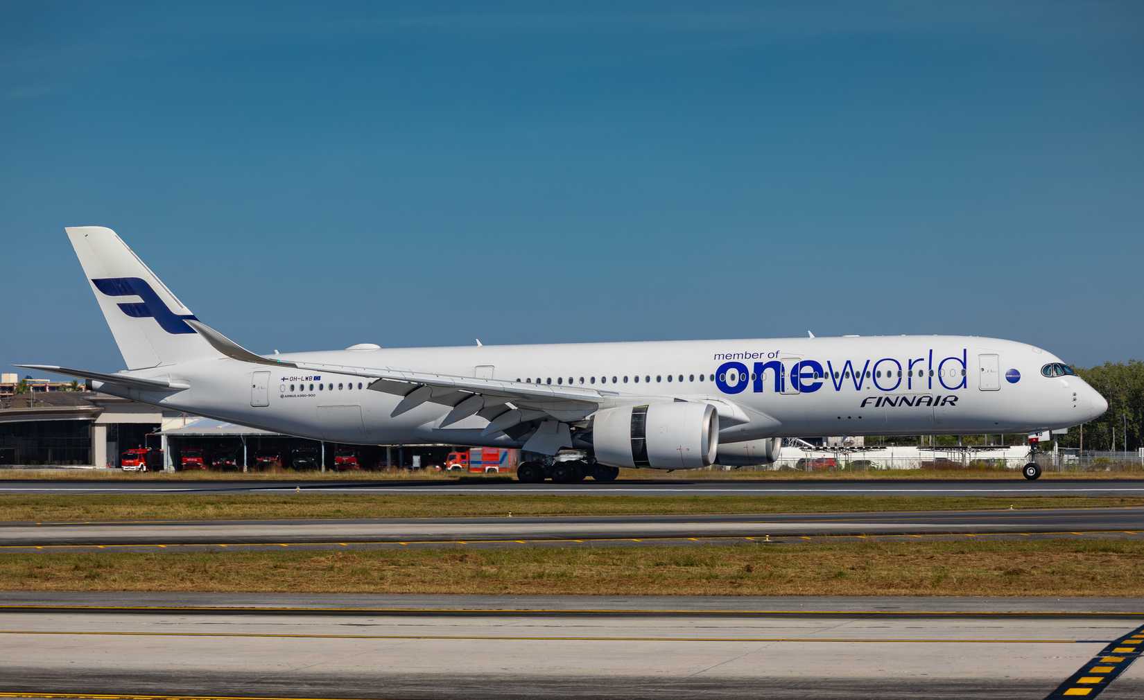 Finnair Airbus A350-941 aircraft in Oneworld alliance livery (OH-LWB) landing at Phuket International Airport.