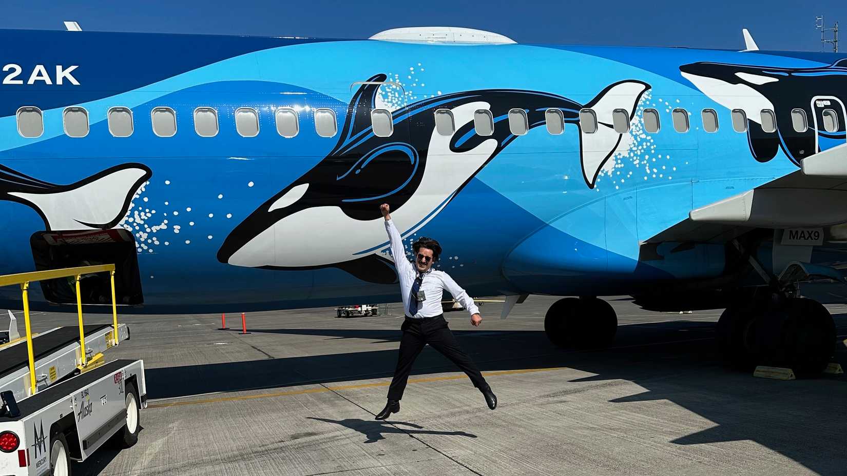 A Pilot in front of his Boeing 737 in a special livery