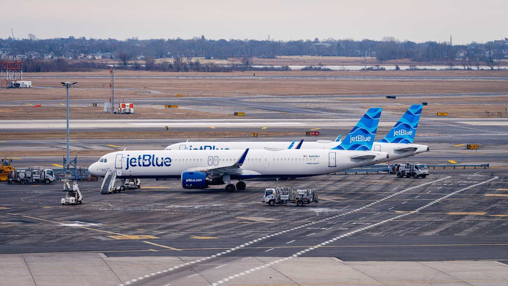 JetBlue Airbus A321 aircraft parked at John F. Kennedy International Airport (JFK) in New York.