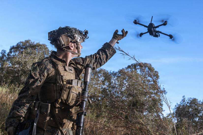 Marine Corps Cpl. Calvin Burke, an intelligence specialist assigned to the 31st Marine Expeditionary Unit, activates a small unmanned aerial system.