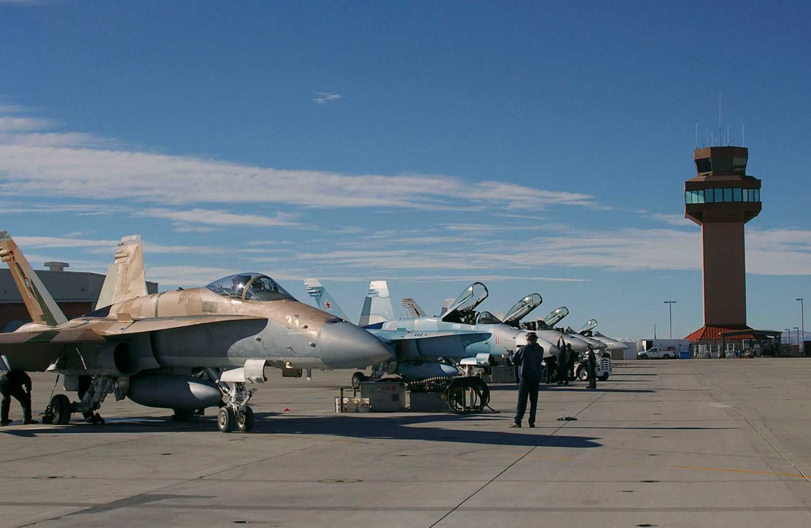 Members of the ground crew prepare FA-18C Hornet strike fighters for flights supporting the final phase of training for Carrier Air Wing (CVW) 8 before embarking for a deployment.