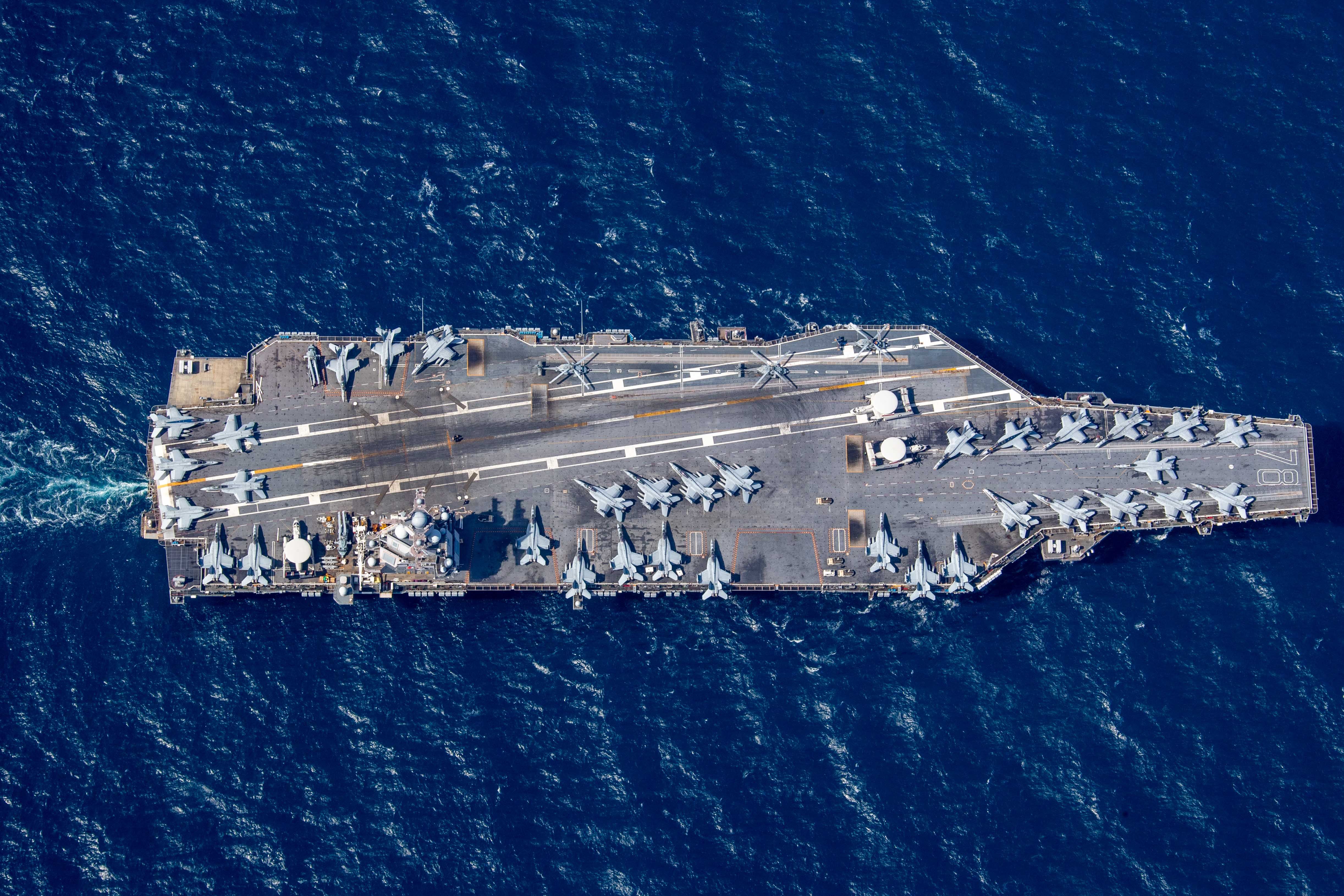 The first-in-class aircraft carrier USS Gerald R. Ford (CVN 78) transits the Atlantic Ocean, March 19, 2023. Ford is underway in the Atlantic Ocean executing its Composite Training Unit Exercise (COMPTUEX), an intense, multi-week exercise designed to fully integrate a carrier strike group as a cohesive, multi-mission fighting force and to test their ability to carry out sustained combat operations from the sea. As the first-in-class ship of Ford-class aircraft carriers, CVN 78 represents a generational leap in the U.S. Navy’s capacity to project power on a global scale. (U.S. Navy photo by Mass Communication Specialist 2nd Class Jackson Adkins)