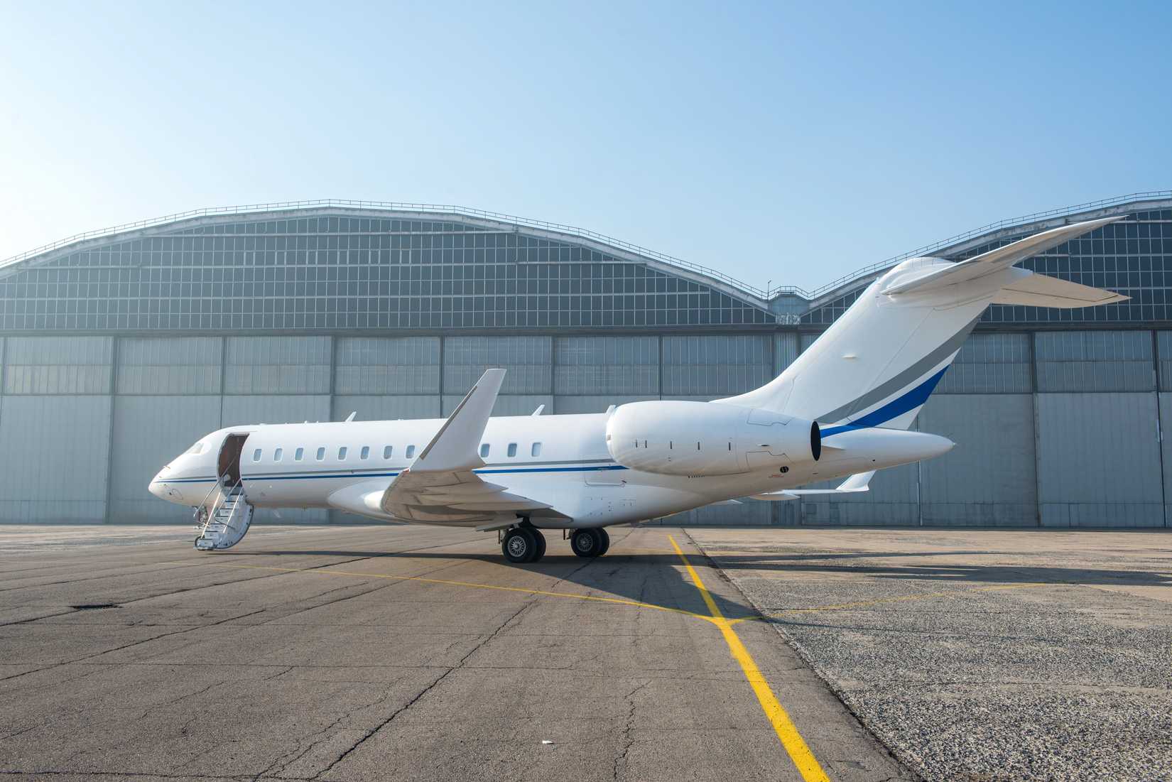 private jet parked on apron