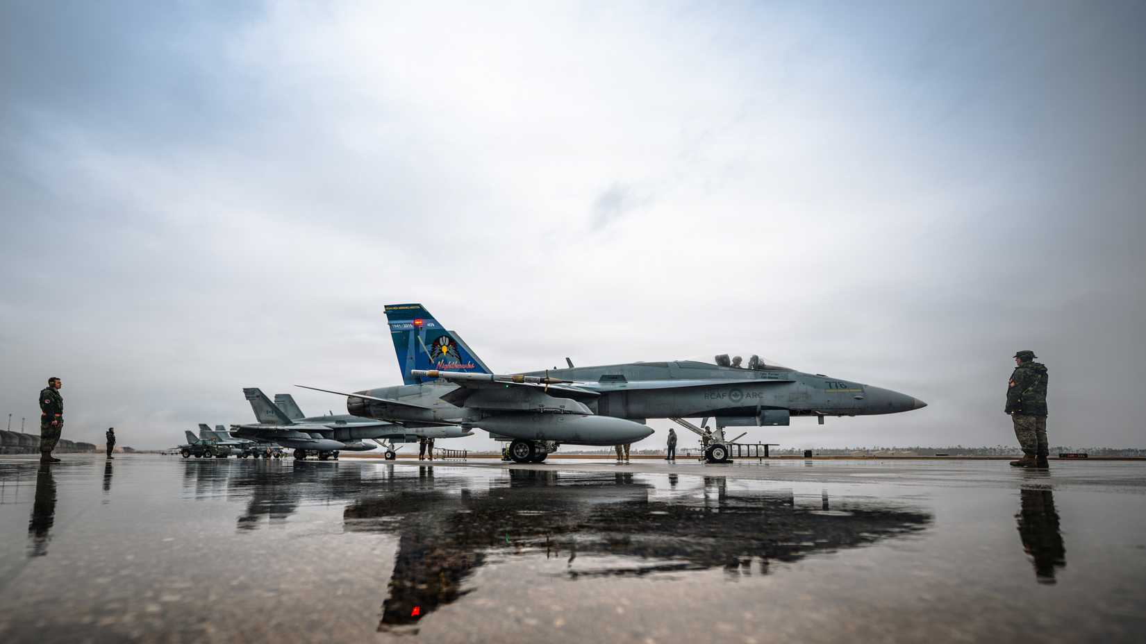 Royal Canadian Air Force personnel inspect a CF-18A Hornet assigned to the 425th Tactical Fighter Squadron, Canadian Forces Base Bagotville.