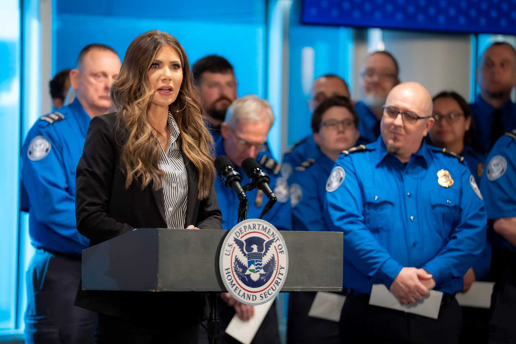 Secretary of Homeland Security Kristi Noem speaks during a press conference and hands out bonus checks to Transportation Security Officers TSA at Minneapolis-St. Paul International Airport.