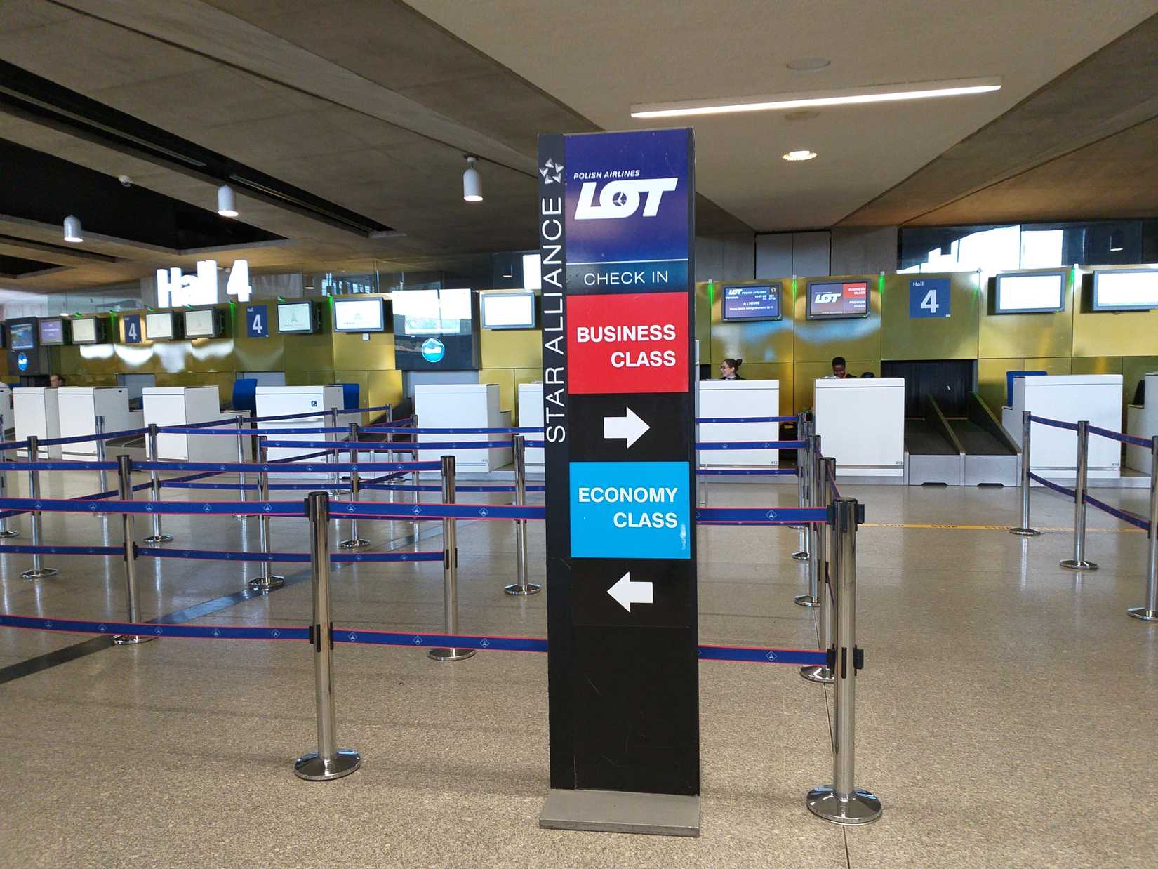 Paris, France, March 8, 2019: Polish airlines check-in board for Economy and Business class in Hall 4, Charles de Gaulle Airport, CDG (Roissy Airport), the largest international airport in France
