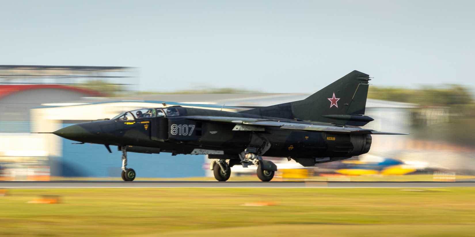 Lakeland, Florida - April 12, 2023: A restored, privately-owned MIG-23, a high speed, jet taking off.