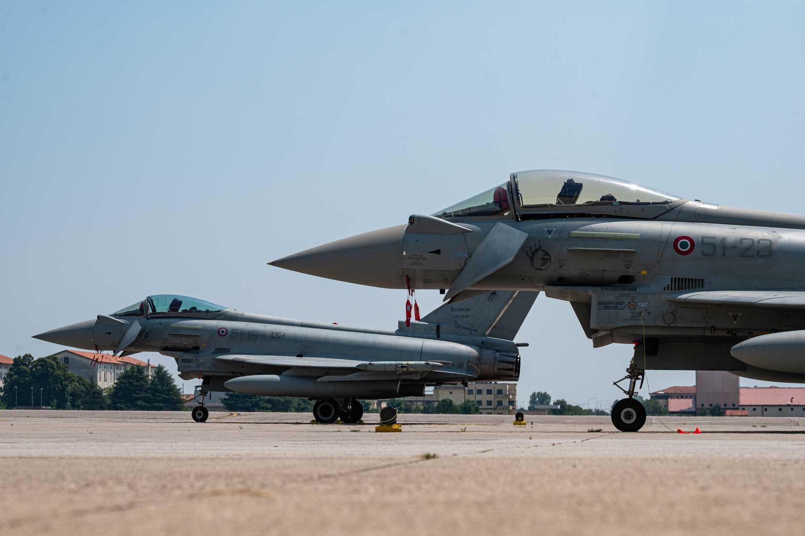 Two Italian air force Eurofighter Typhoons, assigned to the 51st Wing at Istrana Air Base, are parked at Aviano Air Base.