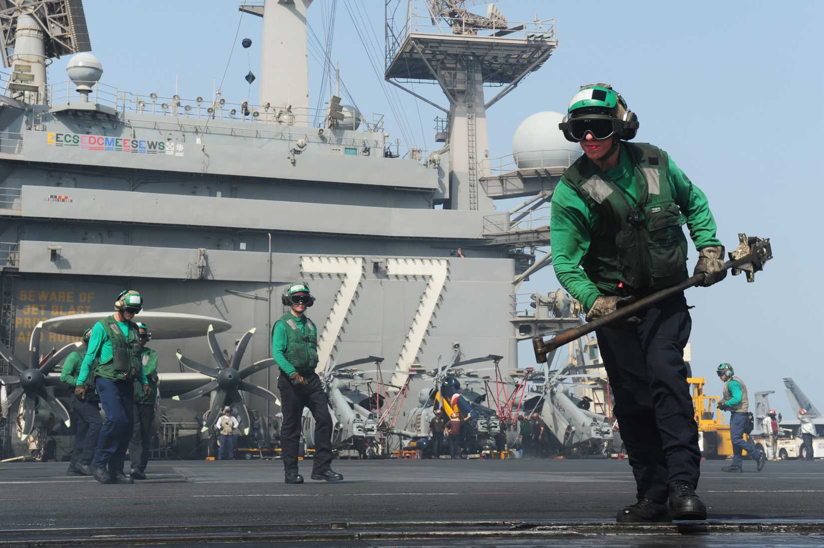 ARABIAN GULF (Aug. 18, 2014) Sailors conduct flight operations on the flight deck of the aircraft carrier USS George H.W. Bush (CVN 77). George H.W. Bush is supporting maritime security operations and theater security cooperation efforts in the U.S. 5th Fleet area of responsibility. (U.S. Navy photo by Mass Communication Specialist 3rd Class Brian Stephens/Released)