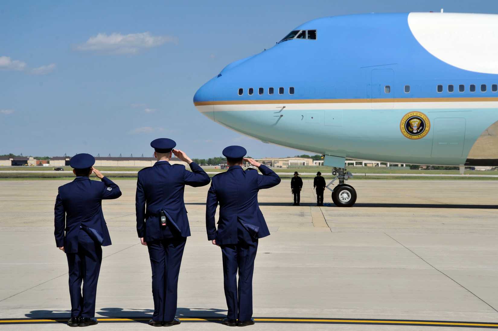 11th Wing, and 89th Airlift Wing airman salute the arrival of Air Force One carrying President Barack Obama, April 27, 2012.