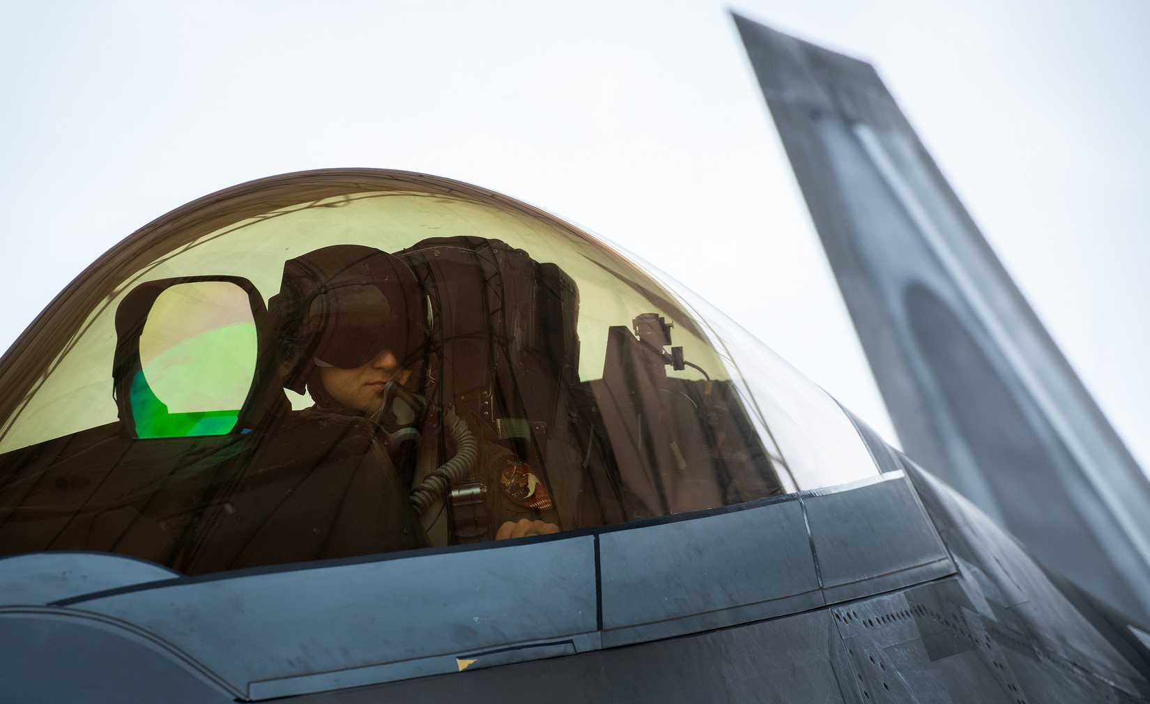 Maj. Brett Gedman, 301st Fighter Squadron, readies for a mission wearing the Next Generation Fixed Wing Helmet