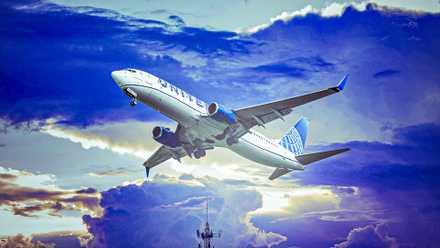 United Airlines Boeing 737-800 soaring in a cloudy sky