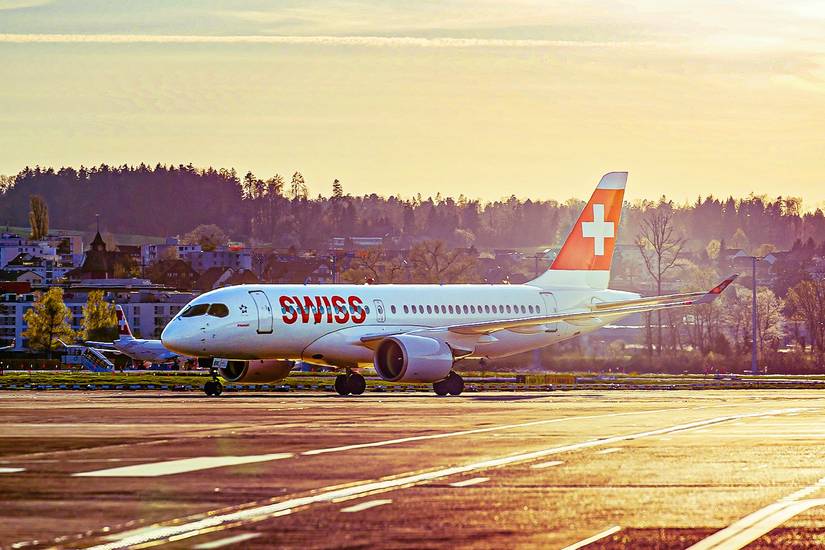 SWISS Airbus A220-100 at sunset