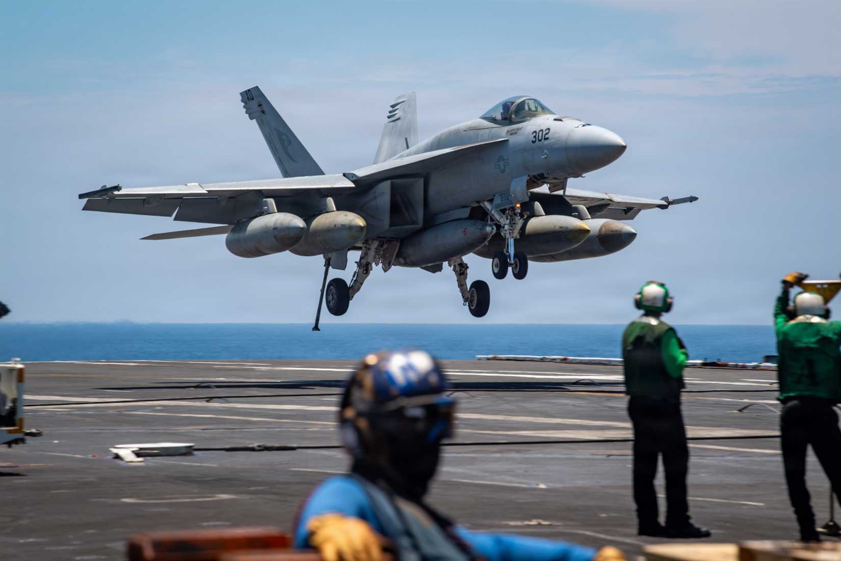 A FA-18E Super Hornet, attached to the “Kestrels” of Strike Fighter Squadron (VFA) 137, prepares to land on the flight deck.