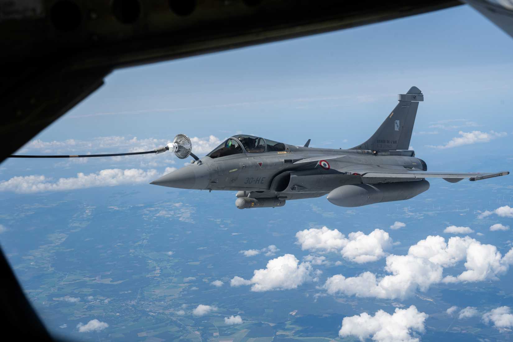 A French Rafale C receives fuel from a U.S. Air Force KC-135 Stratotanker from the 100th Air Refueling Wing, RAF Mildenhall, England, during exercise Atlantic Trident 25.