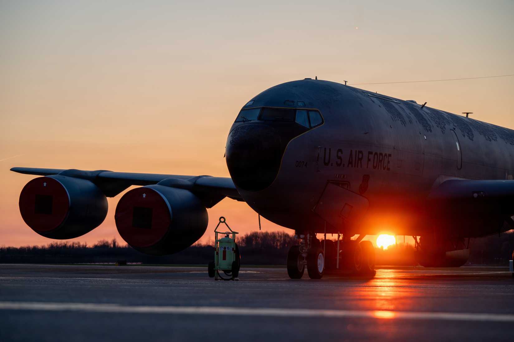 A KC-135 Stratotanker sits on the flight line during a sunrise at the 171st Air Refueling Wing, Apr. 8, 2026.