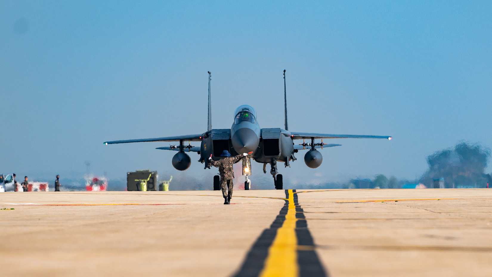 A member of the Republic of Korea Air Force taxis a ROKAF F-15K Slam Eagle at Kunsan Air Base, Republic of Korea, April 12, 2024.