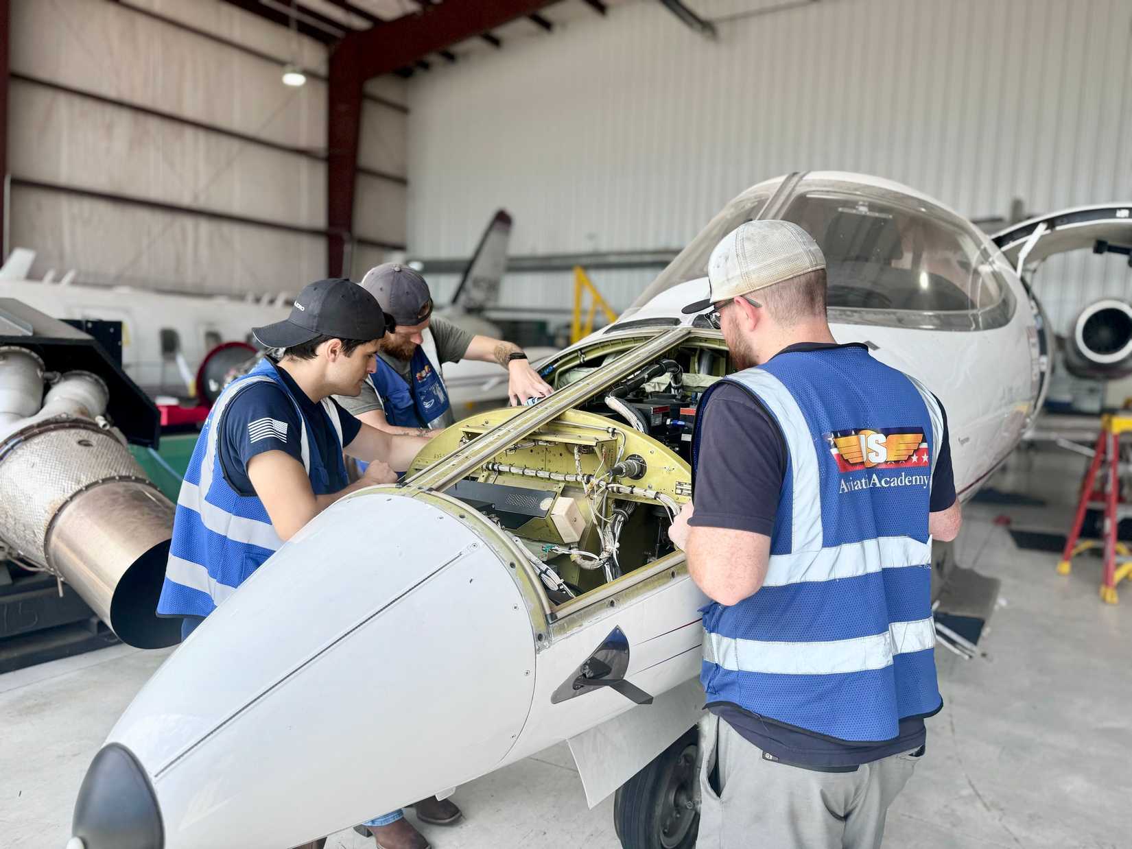 US Aviation Academy Students Working On A Private Jet