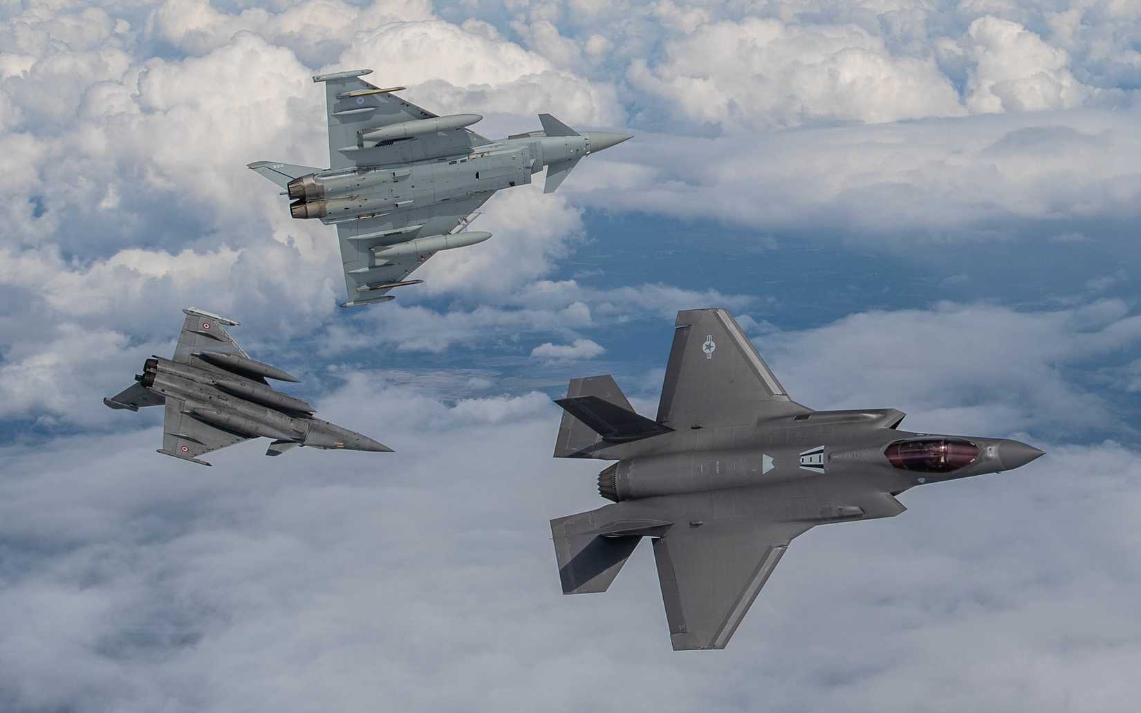 A U.S. Air Force F-35A Lightning II, A Dassault Rafale and a Royal Air Force Eurofighter Typhoon break formation May 19, 2021.