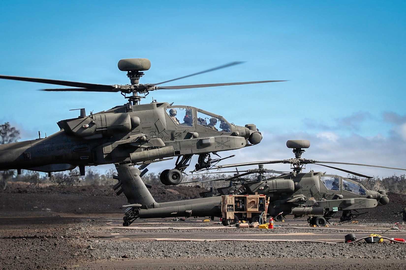 AH-64 Apache Helicopter flight crews assigned to 2nd Squadron, 6th Cavalry, 25th Brigade, staged at a Forward Arming and Refueling Point.