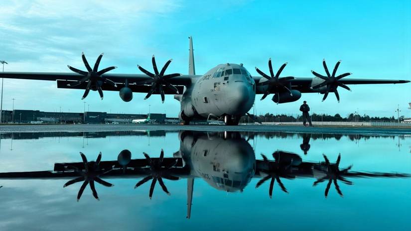 Air Force C-130H Hercules is reflected in shallow water on the flightline at Shannon, Ireland, March 2, 2026.