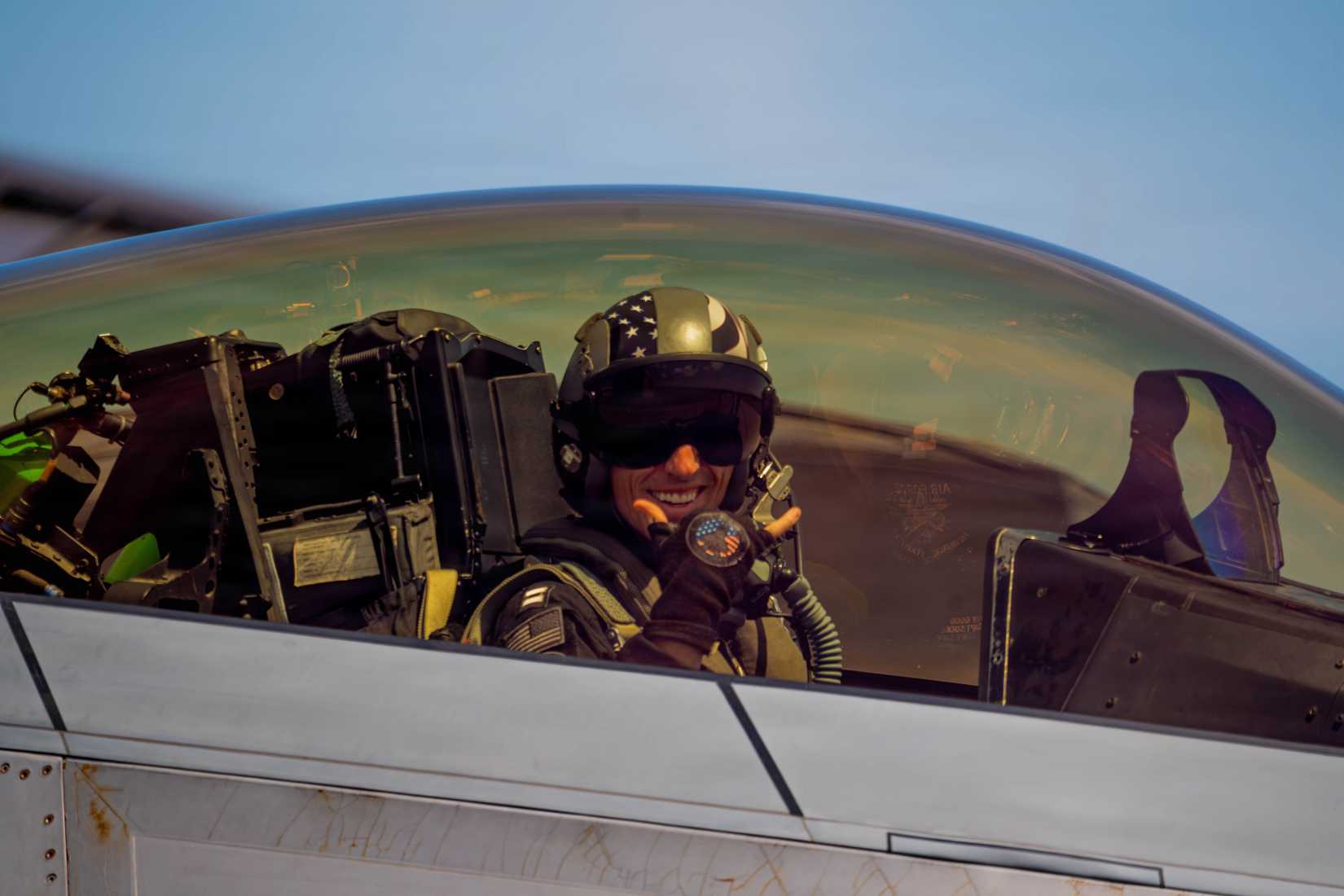 Air Force Capt. Nick “Laz” Le Tourneau, F-22 Raptor Aerial Demonstration Team pilot and commander, strikes a pose from the cockpit.