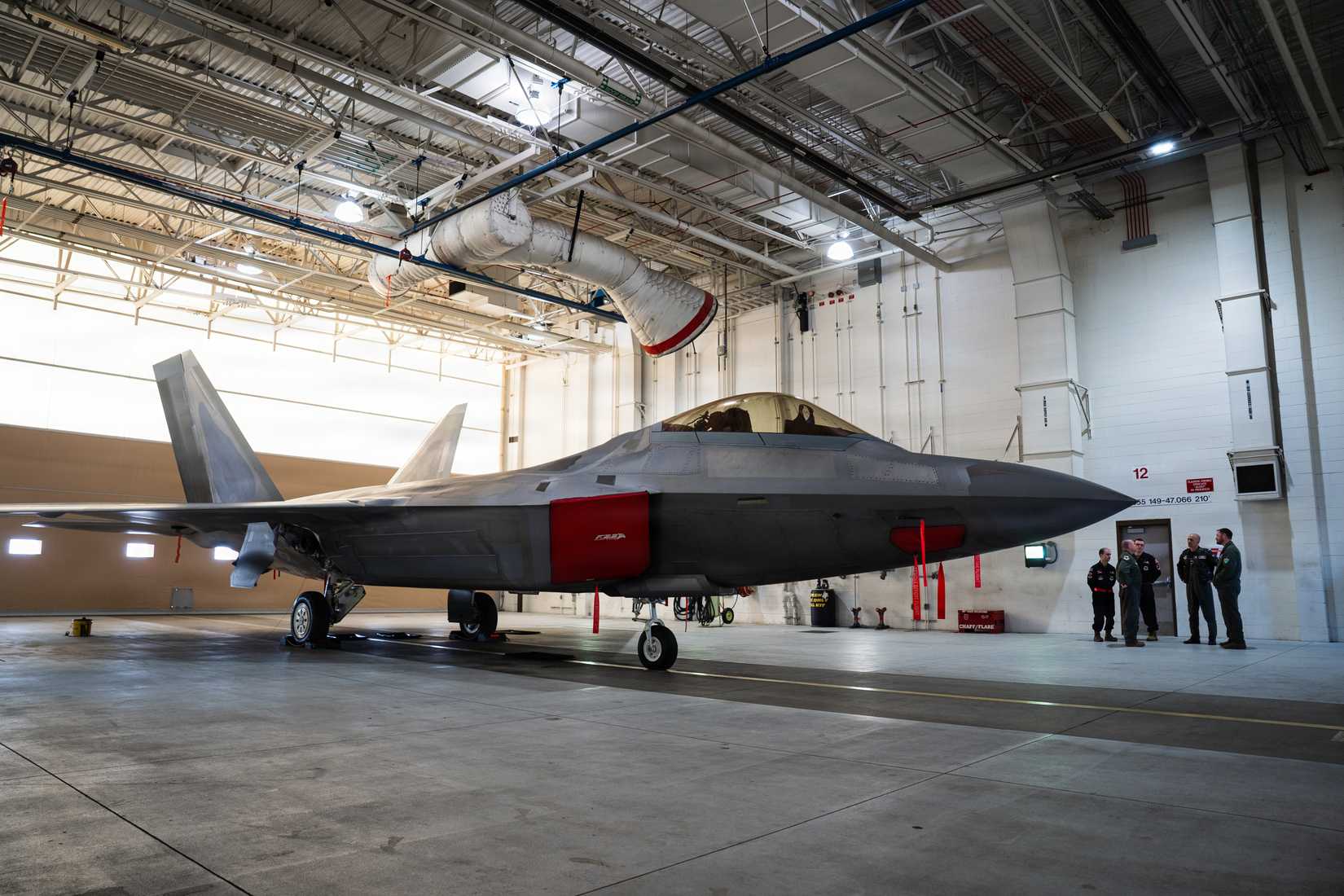 Air Force F-22 Raptor is displayed in a hangar on Joint Base Elmendorf-Richardson, Alaska, April 3, 2026.