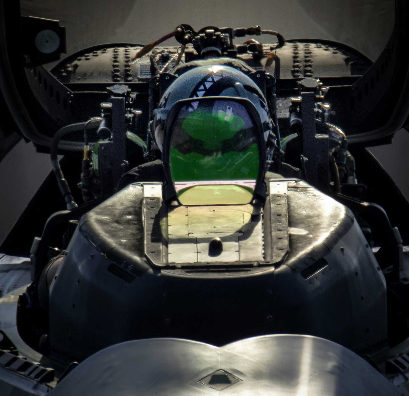 Air Force F-22 raptor pilot assigned to the 199th Fighter Squadron opens his cockpit canopy after landing at Yokota Air Base, Japan.