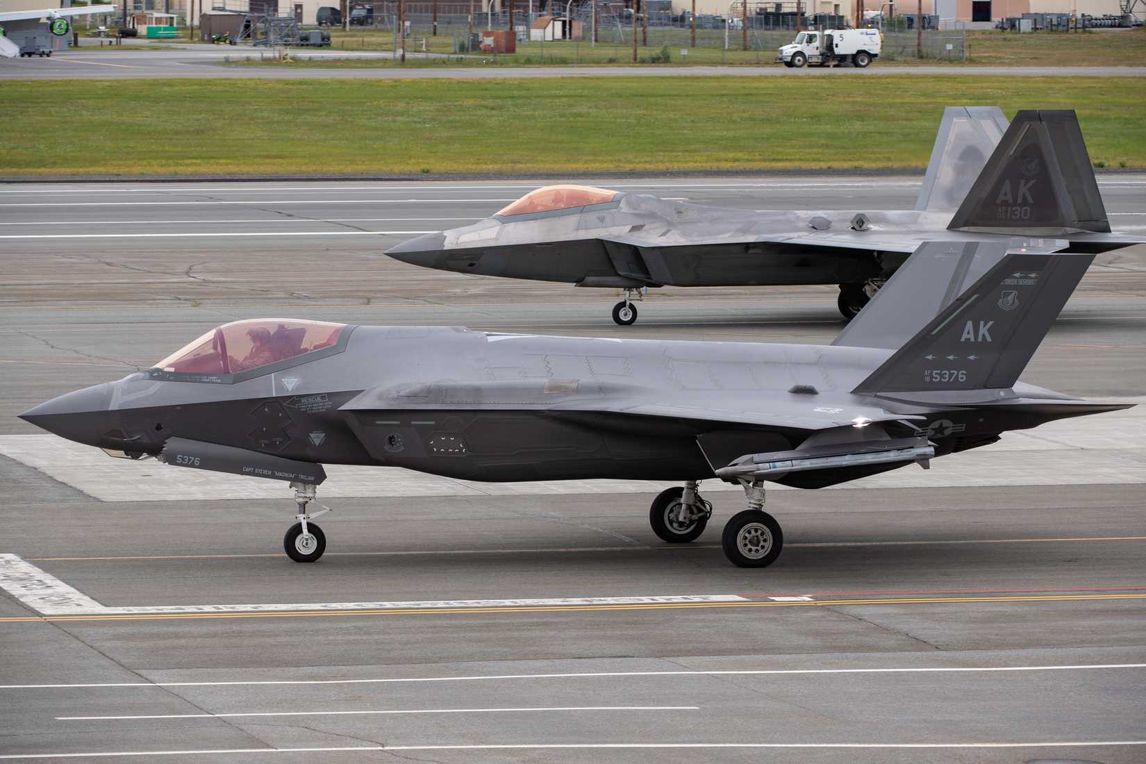 Air Force F-35 Lightning II, assigned to the 354th Fighter Wing, and a 3rd Wing F-22 Raptor taxi down the flight line at Joint Base Elmendorf-Richardson, Alaska, July 11, 2023.