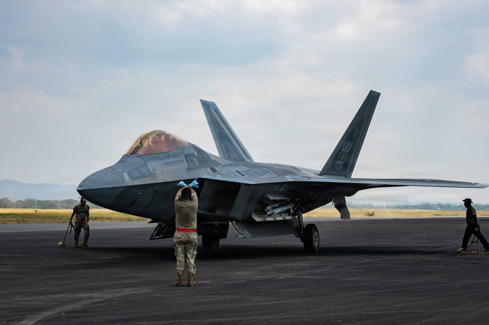 Air Force maintainers prepare a F-22 Raptor, assigned to the 199th Air Expeditionary Squadron.
