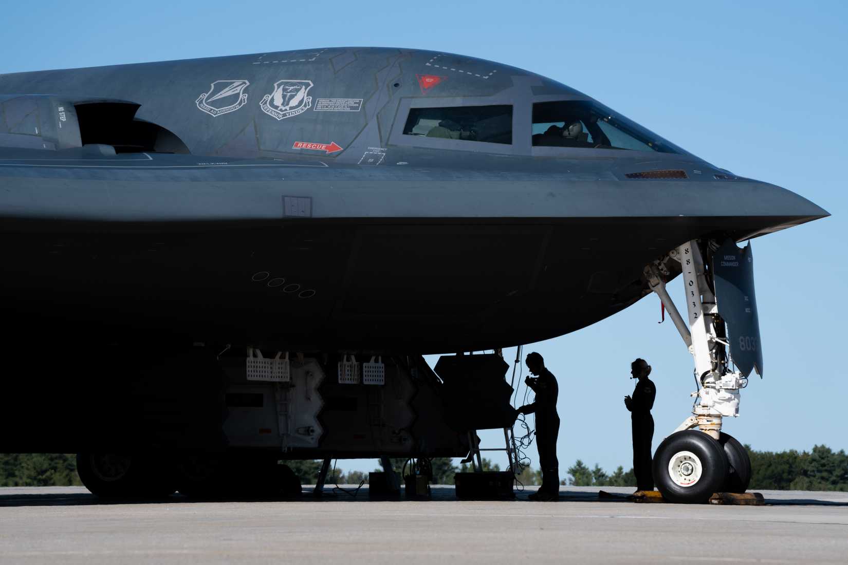 Air Force pilots assigned to the 393rd Bomb Squadron prepare a B-2 Spirit aircraft for hot-pit refueling.