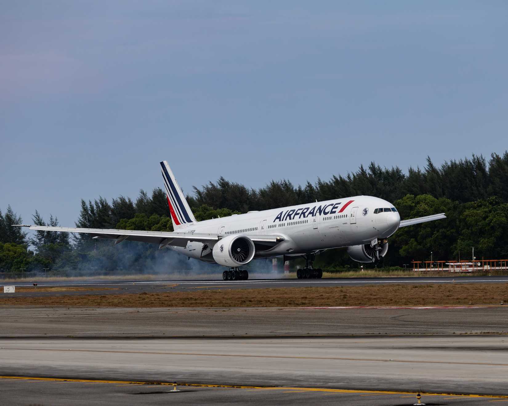 Air France Boeing 777 passenger aircraft touching down on the runway at Phuket International Airport