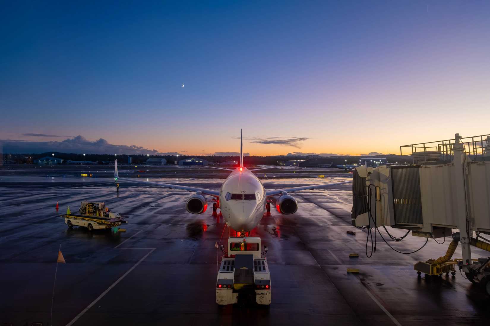 Alaska Airlines aircraft backing away from gate at PDX Portland
