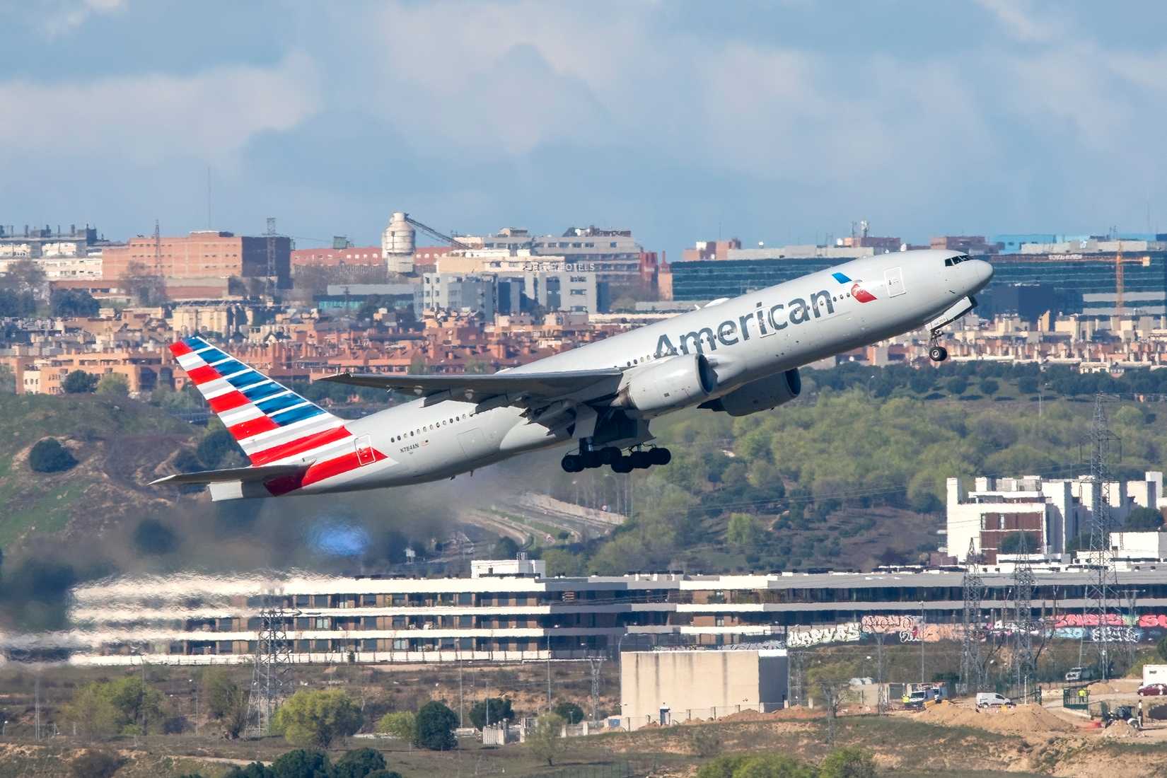 American Airlines Boeing 777 223ER airliner taking off at Madrid Barajas Airport with registration N784AN.-1