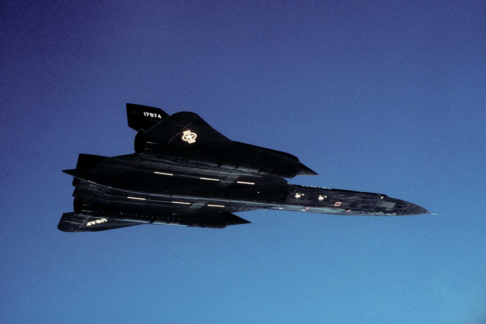 An air-to-air right side view of an SR-71 aircraft from the 9th Strategic Reconnaissance Wing.