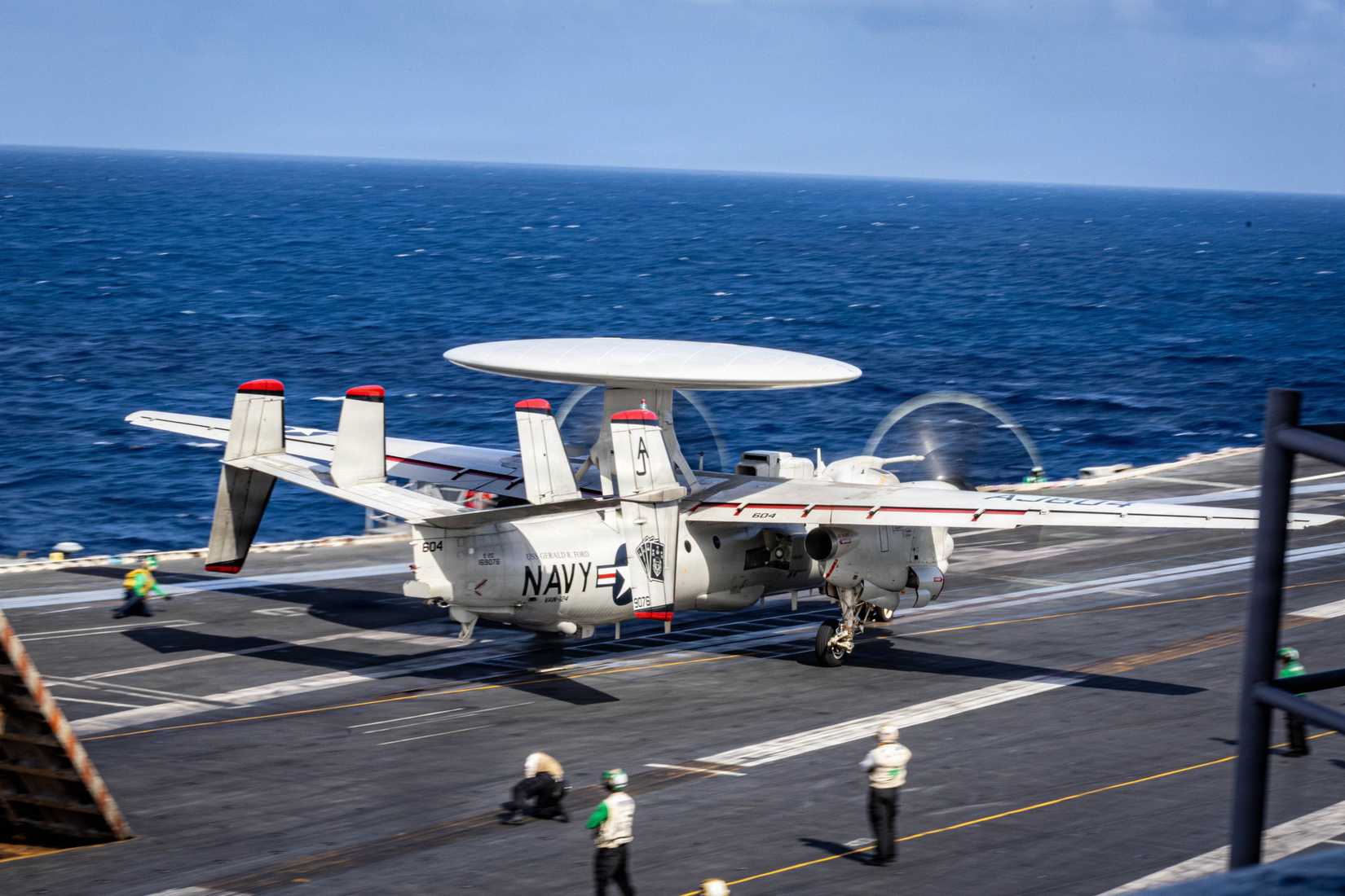 An E-2D Hawkeye aircraft, attached to Airborne Command and Control Squadron 124, takes off from the flight deck.