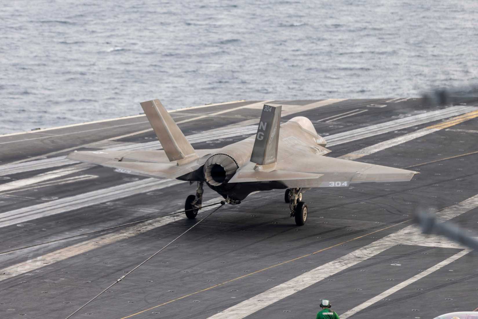 An F-35C Lightning II, attached to Marine Strike Fighter Squadron (VFA) 314, makes an arrested landing on the flight deck.