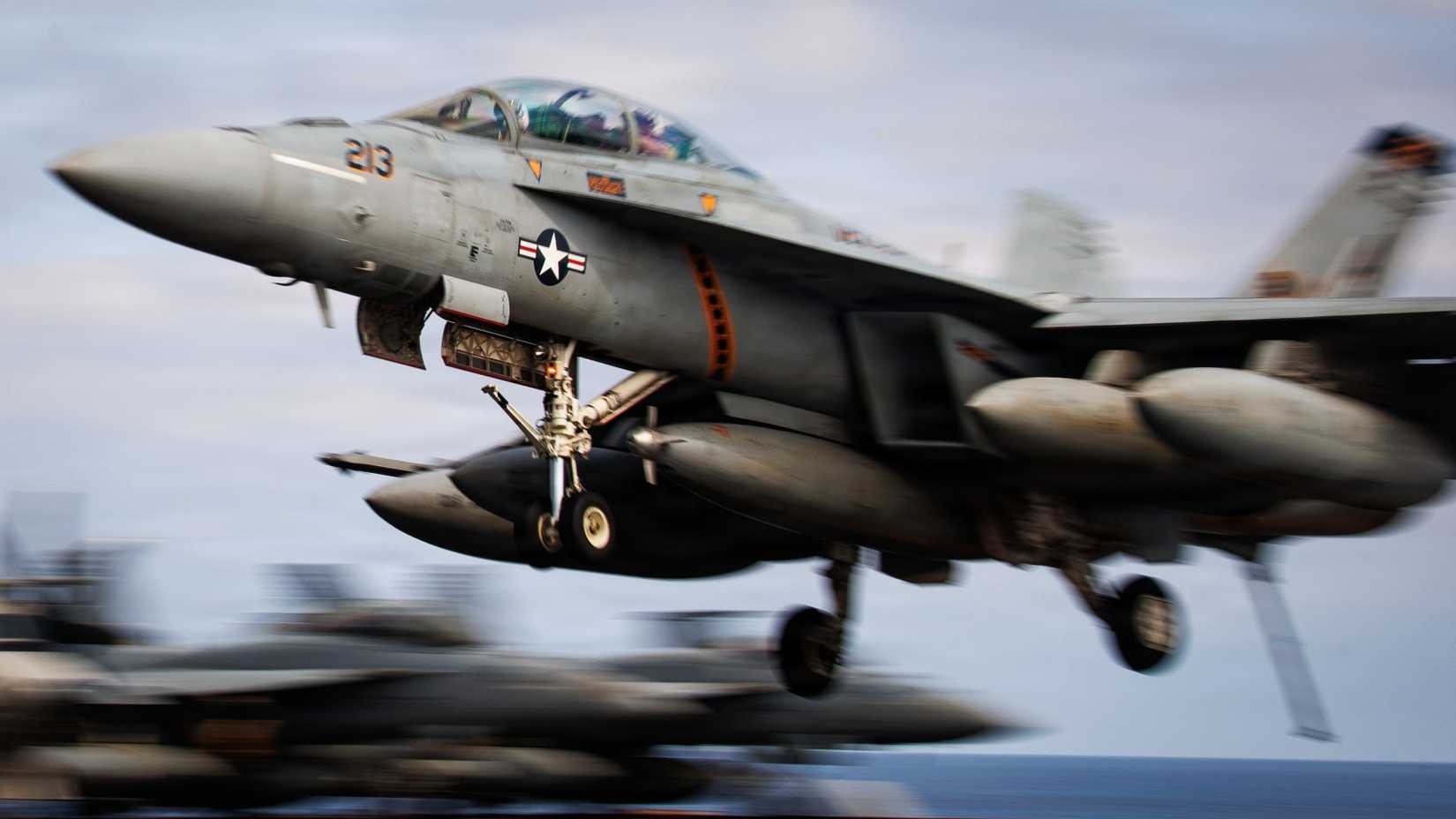 An FA-18F Super Hornet, attached to Strike Fighter Squadron 213, lands on the flight deck of the world's largest aircraft carrier, USS Gerald R. Ford (CVN 78).