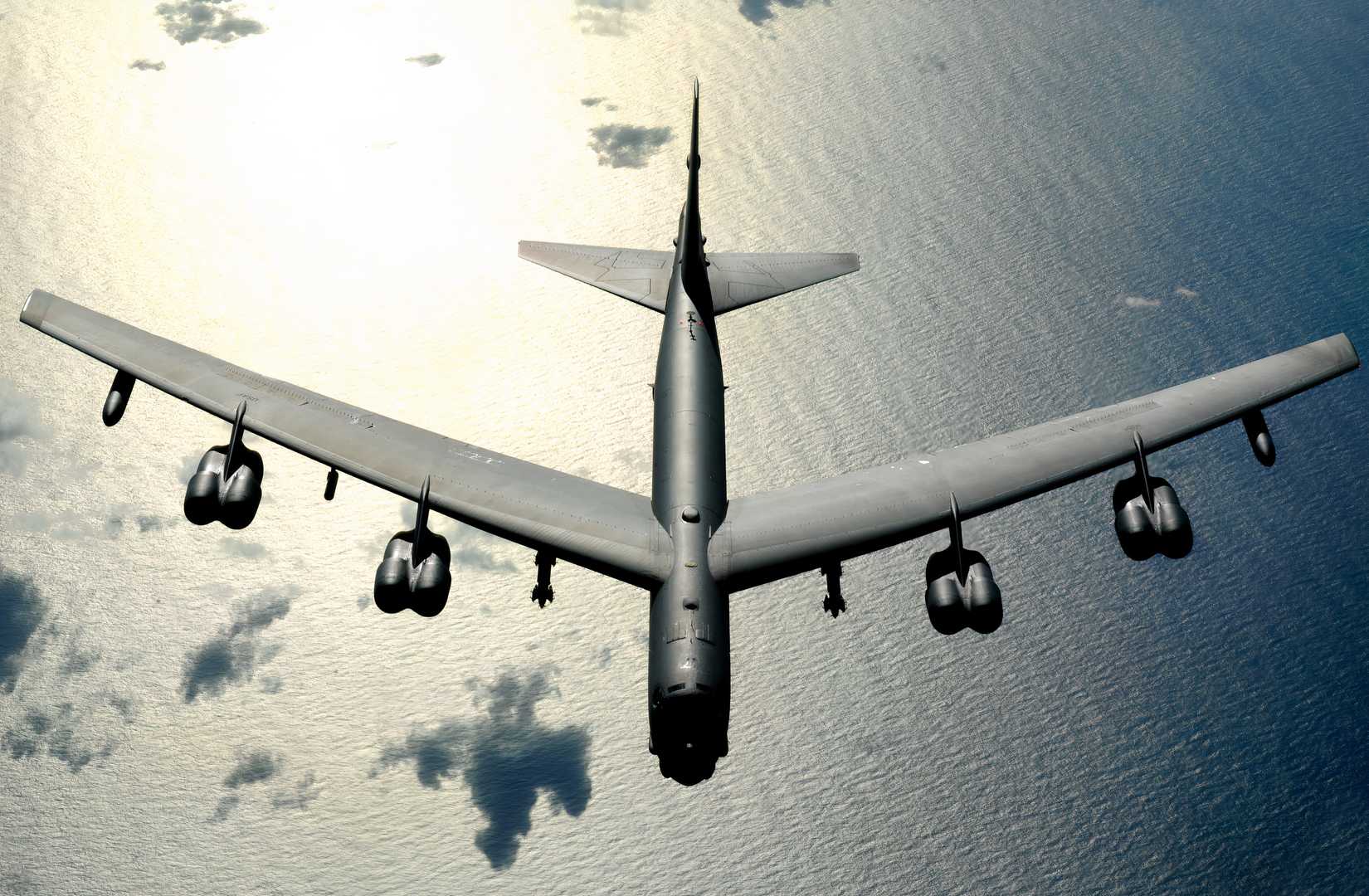 B-52 flying over a large body of water